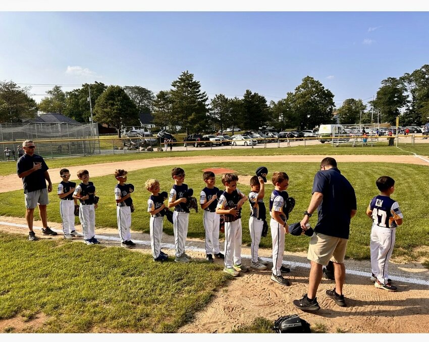 Members of the Barrington AA All-Star baseball team stand for the National Anthem prior to a recent game.