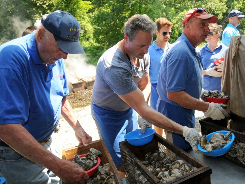 Left-right Bob Pare, his son, Bob Jr., and good friend Eric Delekta, were extremely busy during Saturday&rsquo;s 60th annual Pare Clambake.