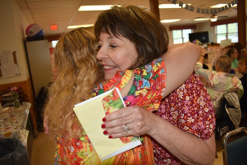 Warren Senior Center Executive Director Betty Hoague embraced the moment during her retirement party on Friday.