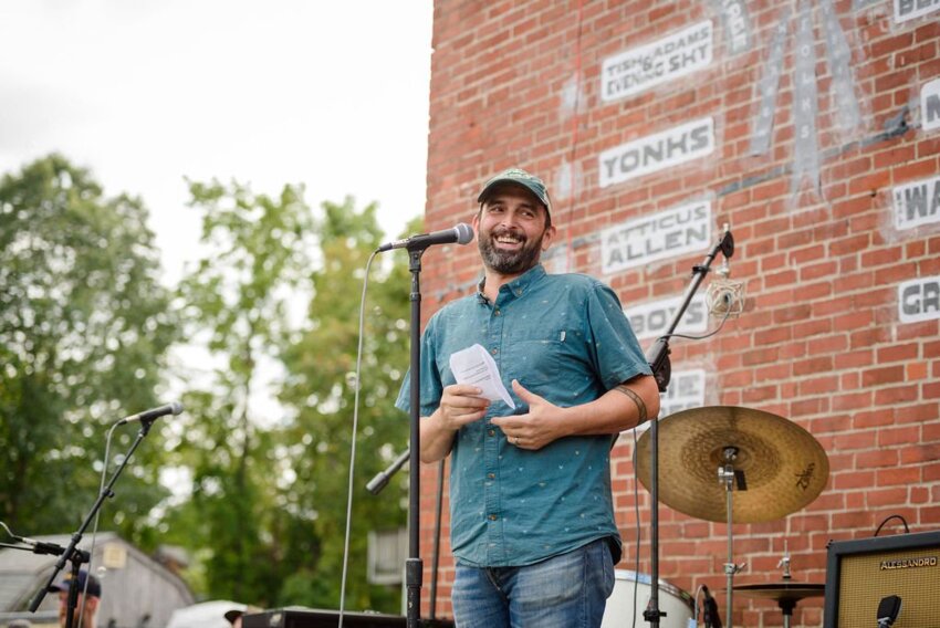 Uriah Donnelly speaks at the Warren Folks Fest, which is one of the popular events that has been organized by The Collaborative, the arts nonprofit group he formed with two of his friends, Adam Tracy and Jeff Danielian.