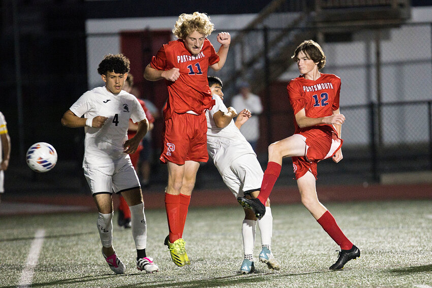 Tyler Both (12) fires a shot off a Central defender which resulted in a corner kick for the Patriots. Landon Rodrigues (11) would end up scoring on the corner kick by Kyle Bielawa.