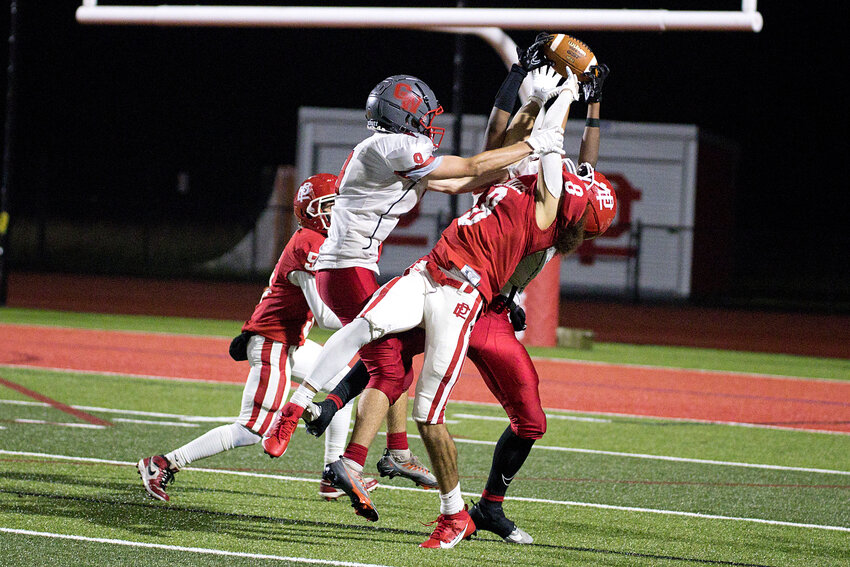 Cranston West opponents break up a pass to East Providence's Cameron Evora in their Division II football game Friday night, Sept. 29.