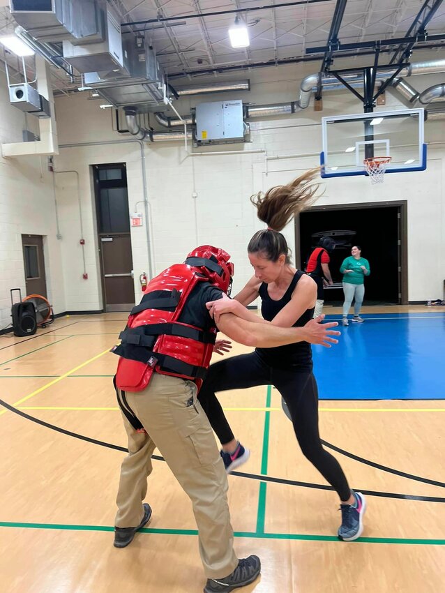 Lt. Steven St. Pierre takes one for the team, as a participant demonstrates her mastery of the techniques taught at Friday&rsquo;s women&rsquo;s self defense seminar. Courtesy Bristol Police.