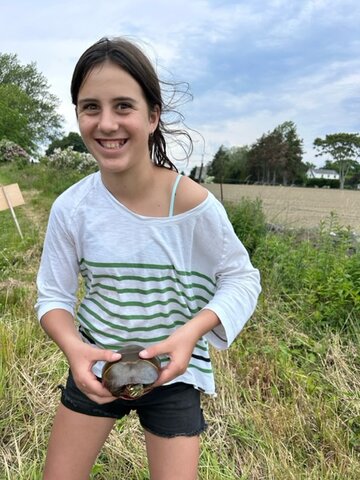Seventh-grade Middletown student Ella Robson encounters local wildlife at Sisson Pond, adjacent to the Portsmouth AgInnovation Farm.