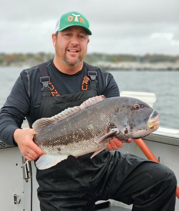Chris &lsquo;Higgie&rsquo; Higgins with the 13.56-pound tautog he caught this week off Newport with Capt. Mike Littlefield of ArchAngel Charters.