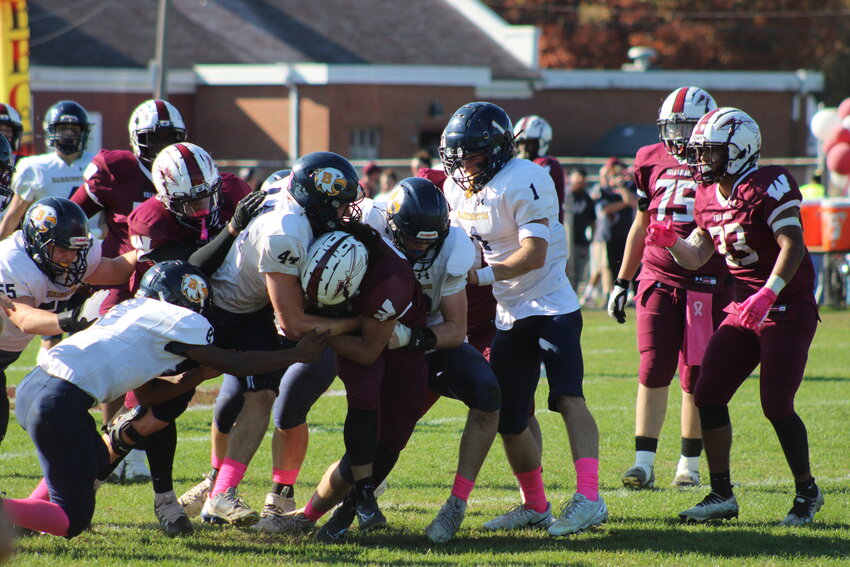 Barrington&rsquo;s Chucky Potter, Will DiGiacomo, Graham Bennett and Trevor Snow (from left to right) tackle a Woonsocket ballcarrier during the Eagles&rsquo; 42-14 win on Saturday.