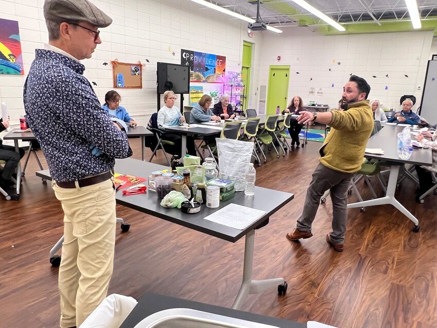 Fuller Learning Center coordinator Ryan McCauley (right) introduces city resident John Keever who recently presented a vegan baking demonstration as part of the &quot;Meatless Meals&quot; program.