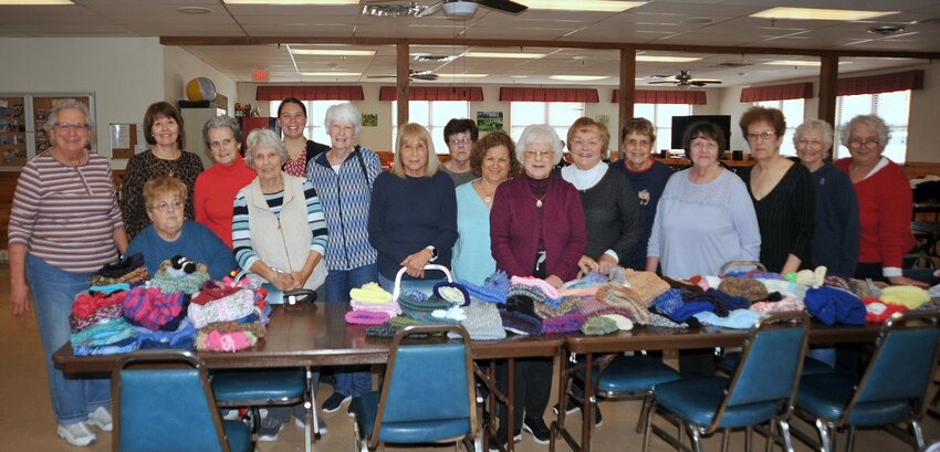 The Warren Senior Center Knitting and Crocheting group accomplished a record-setting achievement this year. Standing left-right are Pat Thivierge, Retired Senior Center Executive Director Betty Hoague, Nancy McMahon, Rita Minutelli, Current Senior Center Executive Director Kyra Little, Pauline Souza, Nancy Pereira, Pat Hunter, Gail Woodward, Betty Hedley, Marilyn MacDougall, Marie Floor, Agnes Mello, Elsa Lopes, Kathy Beresford, and Sarah Weed. Seated at left is Delores Floor.