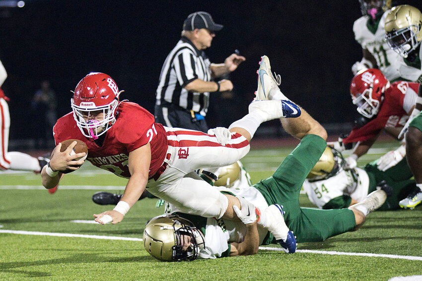 EPHS quarterback Jacob Duarte dives for some extra yardage in the Townies' non-league outing against Hendricken Friday night, Oct. 27.