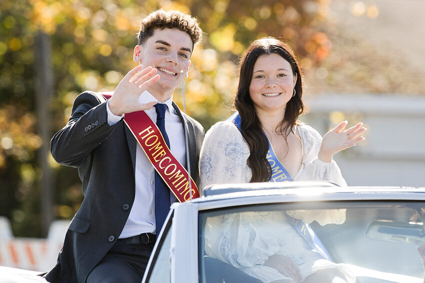 Aiden Echevarria and Gabriella Humes, Portsmouth High School&rsquo;s 2023 Homecoming king and queen, wave to the crowd from their perch in a convertible during the Homecoming Parade on Saturday.