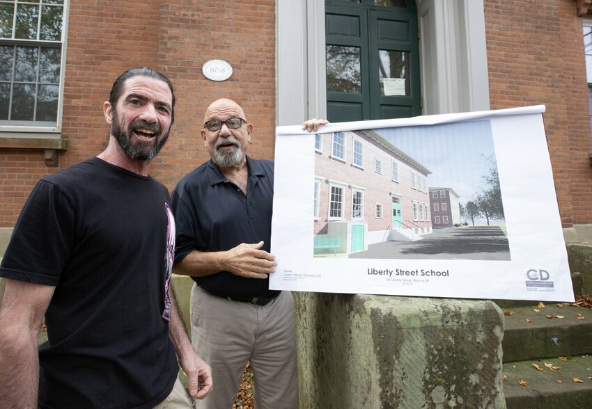 Ron Louro (left) and John Lannan (right), discuss their plans to renovate the former Liberty School during an interview last week. They defended their plan and emphasized how they have been more than willing to listen to feedback from the Town and the community.