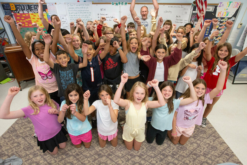 Students in Mark Whittaker&rsquo;s and Kristin Mitchell&rsquo;s classes at Hampden Meadows School celebrate after hearing that they will be reporters for the Barrington Times Kids Corner page.