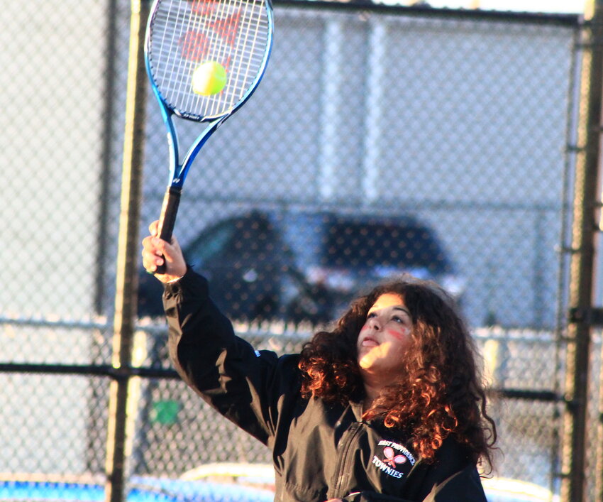 East Providence's Ava Domingues poaches at the net during her win with partner Isabella Periquito in the D-III semis Thursday, Nov. 2.