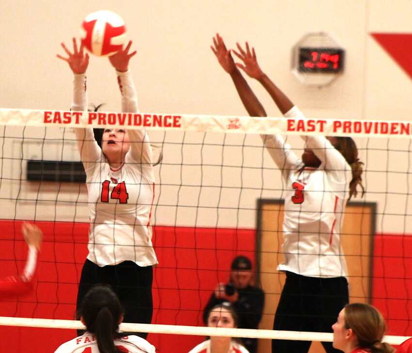Keira Mullen and Trinity Johnson-Carter combine for a block on match point for EPHS in the Townies' Division II quarterfinal playoff sweep of Cranston West Thursday night, Nov. 2.