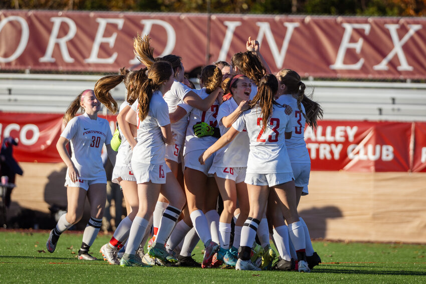 Members of the Portsmouth High girls&rsquo; varsity soccer team mob one another after winning the Division II state title at Rhode Island College on Saturday. Abby Costa, who scored two of the Patriots&rsquo; five goals, is at right, giving hugs to Sophia Karousos (23) and Emma Norton (3).