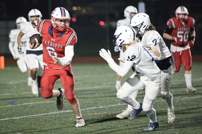 The Patriots&rsquo; Tyler Hurd makes a move as a pair of Westerly defenders close in during last Thursday night&rsquo;s game at Portsmouth.