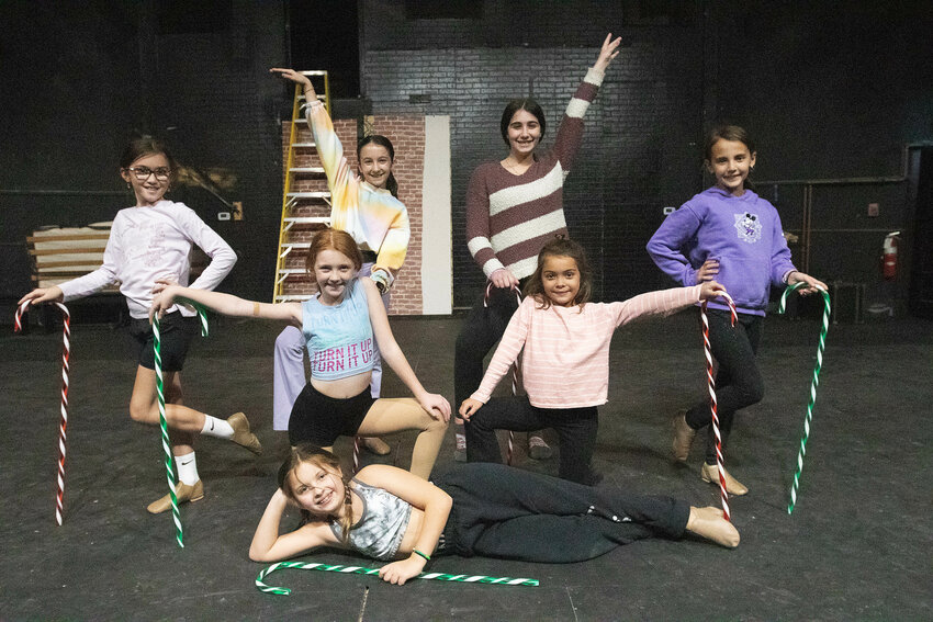 Jasyri Goldstein, Adrianna Dufault, Olivia Costa, Charlotte Lake, Kinley Ferreira, Laila Lugo and Ella Kischko pose for a photo at the revamped In Your Ear Theatre during rehearsal.