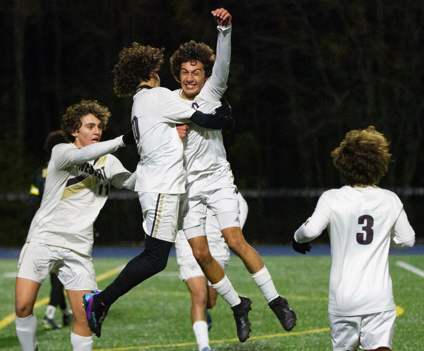The Westport soccer team is headed to the championship after blanking Boston International 2-0 during the D-5 semifinals on Tuesday night. In photo, Will Quinlan (left), Nazaiah Pacheco celebrate with Zachary Lopes after he assisted on Tommy Bernard's second half goal.