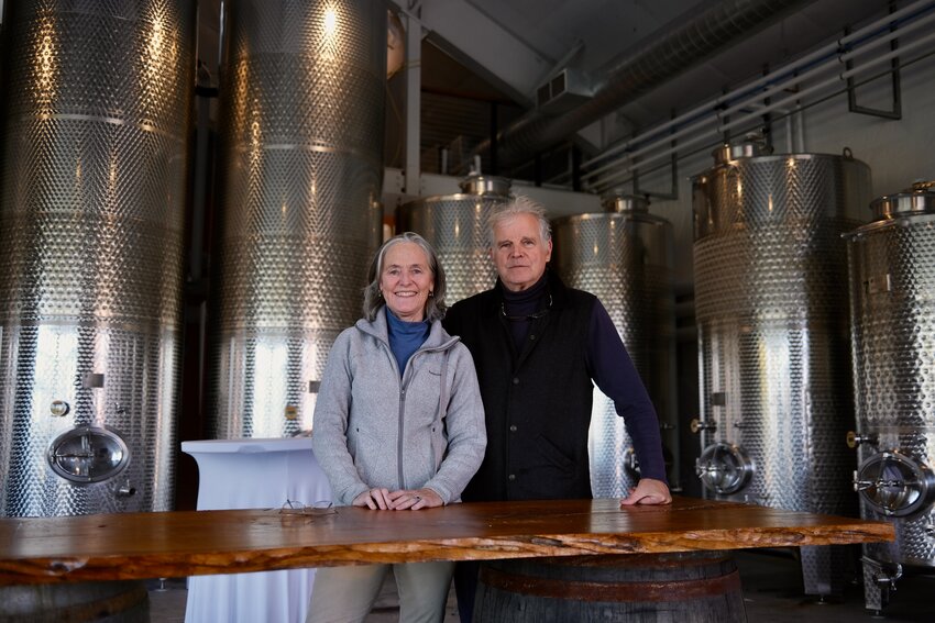 Nancy and Bill Wilson inside the new Wine Education Center at Greenvale Vineyard. The largest tanks behind them hold more than 2,000 gallons of wine.