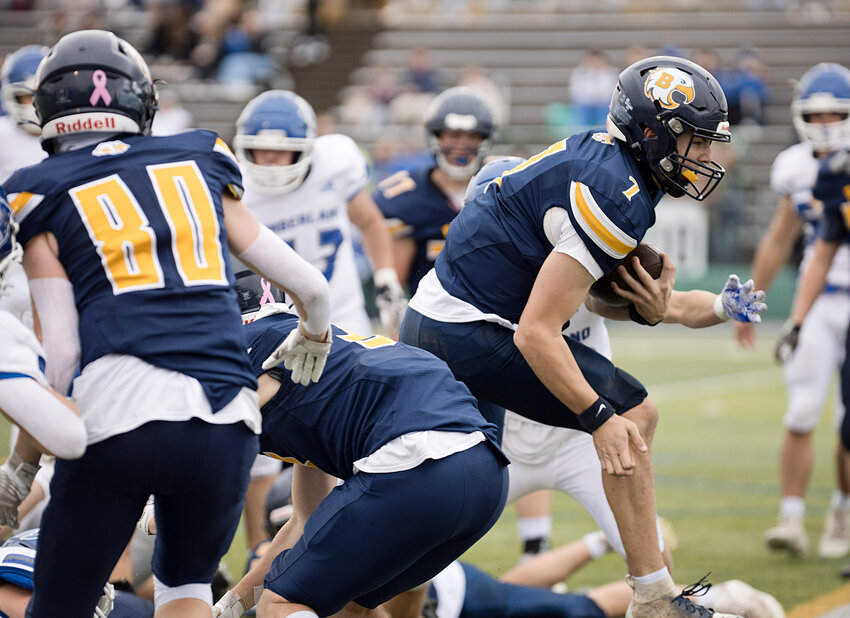 Barrington High School quarterback Alex McClelland scores a touchdown in the Division II State Championship game.