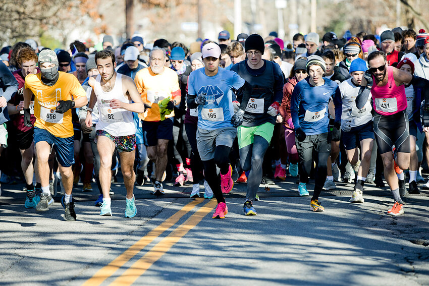 Runners take off at the start of the 24th annual Trot Off Your Turkey 5K race, Saturday. The road race raises money for St. Luke&rsquo;s School.