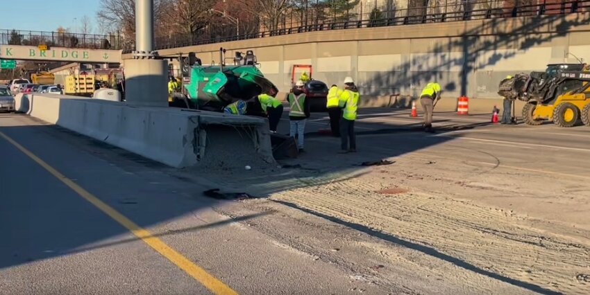 Crews work to open a pair of westbound bypass lanes on the east side of the Washington Bridge Thursday, Dec. 14. The lanes were open by rush hour the following morning December 15.
