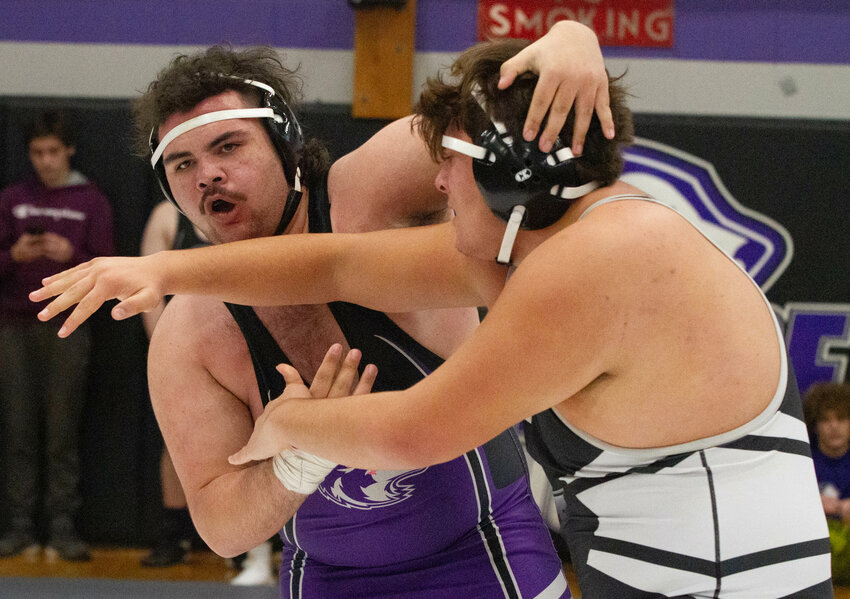 Heavyweight Quentin Smith, a sophomore, manhandles an opponent during the annual Sharon Lombardo tournament at the high school on Dec. 16. Mt. Hope placed third at the event.