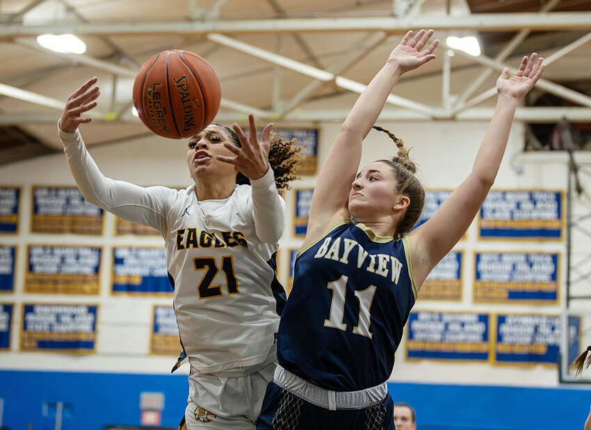 Barrington High School&rsquo;s Isys Dunphy reaches for the rebound while battling Bay View, Thursday.