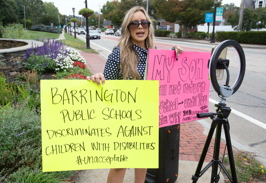 &ldquo;He can&rsquo;t hear from there.&rdquo;  &mdash; Sophia Melisaratos, during her protest in front of the Town Hall. Melisaratos was calling for the school department to address concerns she had shared about her son's issues at school. She initially held her protest in the middle of County Road, but police asked her to move to the sidewalk.