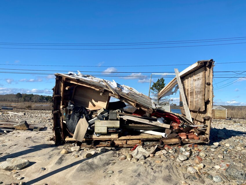 Parts of East Beach Road lay in ruins after the storm one week before Christmas.