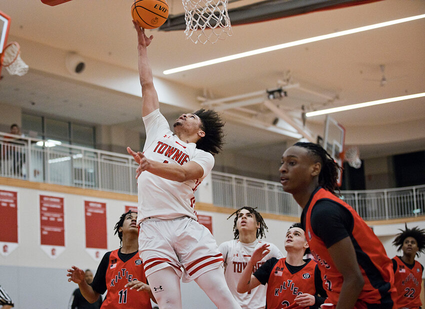 Franklin Carela Lopez rises at the rim to finish a layup for the East Providence High School boys' basketball team during the Townies' win over visiting Mt. Pleasant Monday night, Jan. 8. The victory was the third Division I win in a row for the locals.