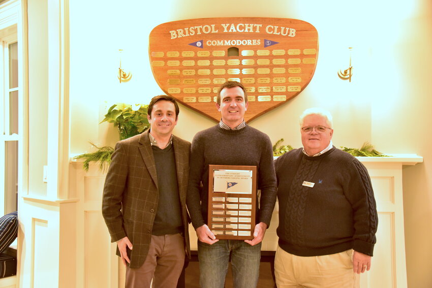 Charlie Enright is pictured here with the Bristol Yacht Club&rsquo;s new perpetual trophy, the Enright Outstanding Achievement in Offshore Sailing Award, flanked by friend and fellow sailor Chris Brito (left) and BYC Commodore Paul Redman.