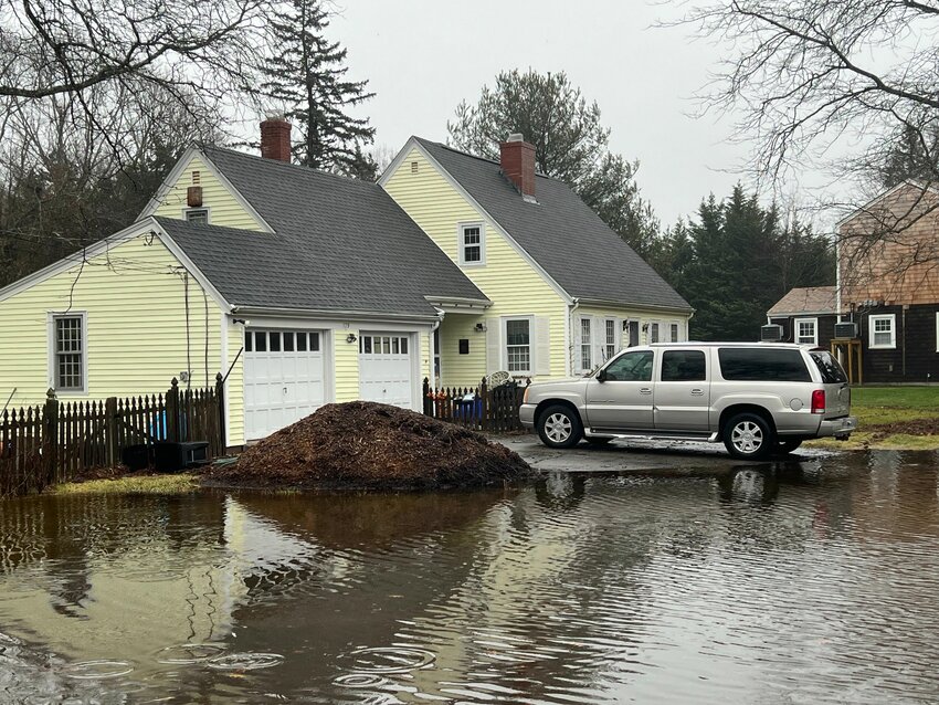 This home on New Meadow Road was nearly surrounded by flood waters on Saturday morning.