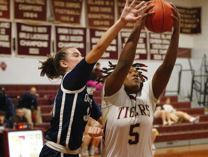 Jah'niece&nbsp;Branch&nbsp;pulls down a rebound in the first half of the Tiger's loss to Moses Brown on Thursday night. Branch led the team in scoring with 12 points.