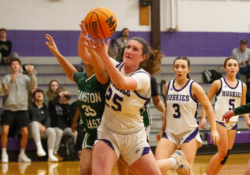 Emily Moran pulls down a rebound with teammates Sofia Haberman (middle) and Maddy Butterworth (right) during Mt. Hope's win over Cranston East on Thursday.