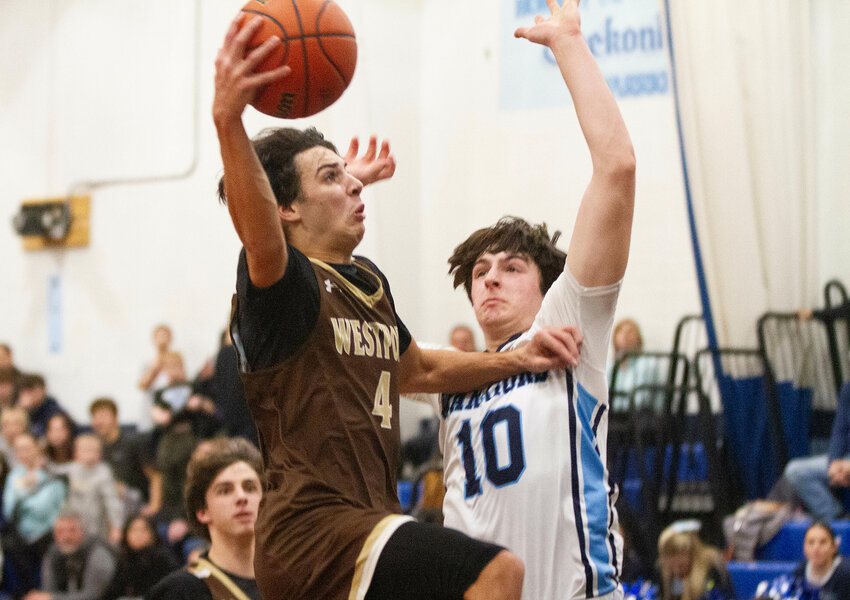 Owen Boudria soars to the basket in the fourth quarter. Boudria scored 29 points as Westport fell to Seekonk 60-50.