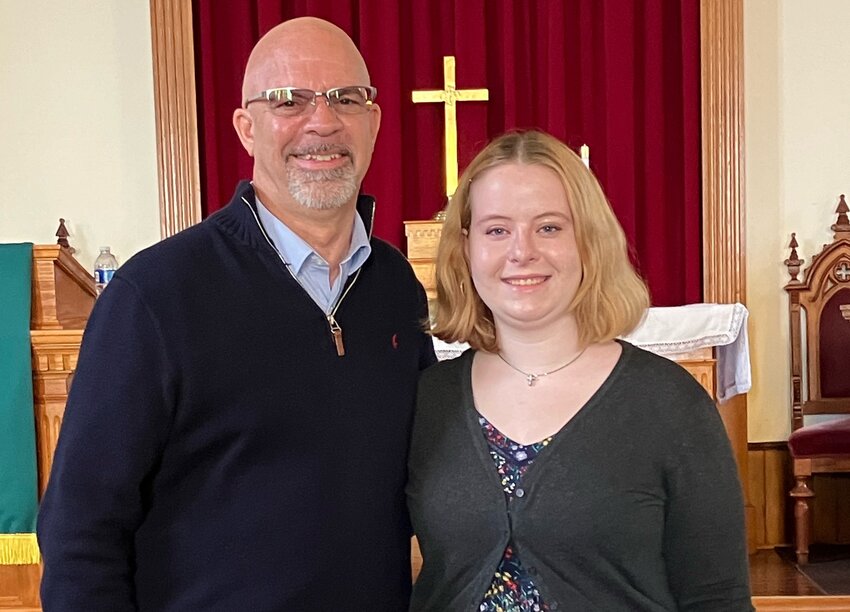 Colleen Newcomb spends a moment with Westport Point United Methodist Church pastor Seth Fortier, following Sunday&rsquo;s services.