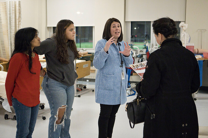 Health Occupations Instructor Nicole Lakin (middle) describes the curriculum at the EPHS Open House January 11.