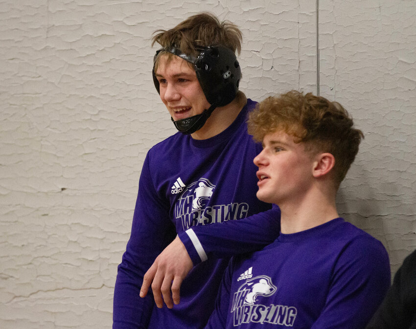 Andrew McCarthy and James Thibaudeau chat while waiting for their turn on the mat on Wednesday night. The two drilling partners both achieved 100 wins for their careers.