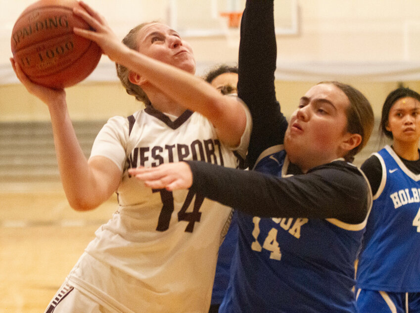 Skylar Rezendes drives to the hoop during the game. She led Westport with 20 points.