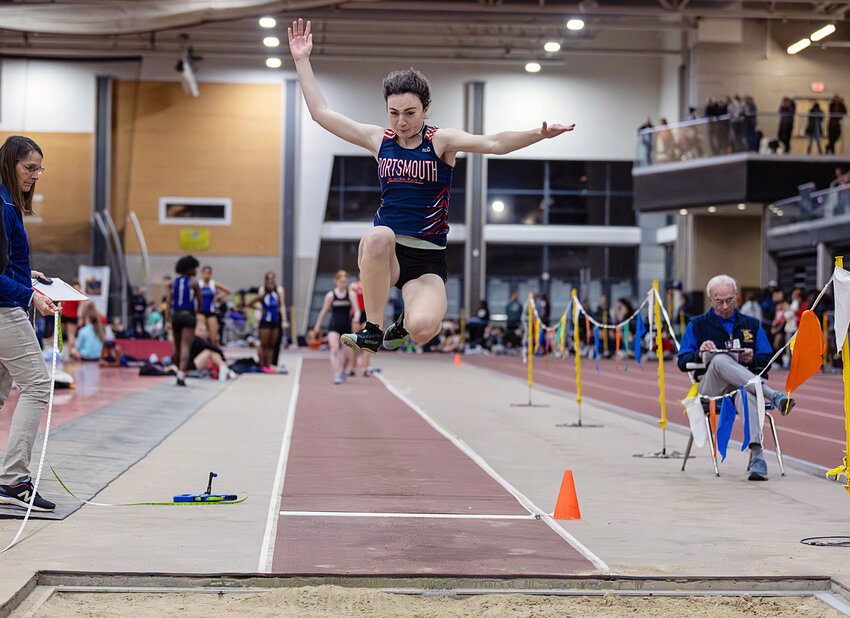 Portsmouth High&rsquo;s Claire Hook leaps to victory while competing in the long jump during Saturday&rsquo;s indoor track Division Championships. She cleared 16 feet, 11.5 inches for a new school record.