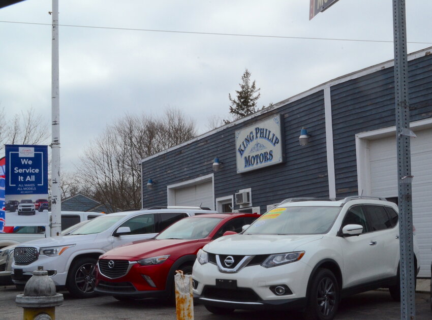 King Philip Motors, located at 331 Metacom Ave., is being sued by the state Attorney General&rsquo;s Office, which alleges the dealership knowingly sold and advertised vehicles that hadn&rsquo;t passed state inspection.