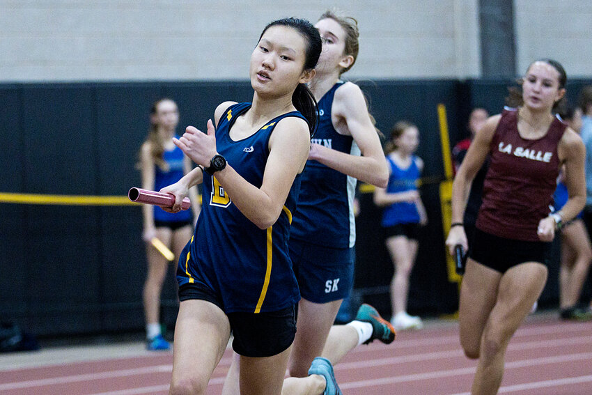 Barrington High School's Indie Lamb powers around the track in the 4x400-meter relay event.