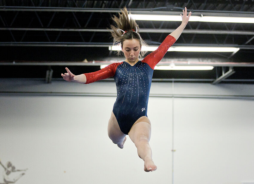 The Patriots&rsquo; Rowan Snyder leaps across the beam while competing in Sunday&rsquo;s meet against Mt. Hope High School. She earned a 9.25 on the event and led her team with an all-around score of 35.0.