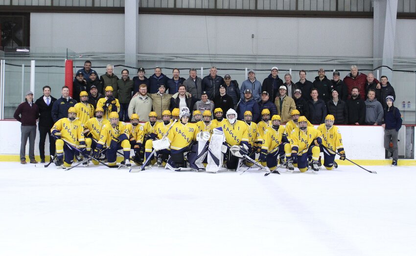Members of this year&rsquo;s BHS boys ice hockey team gather for a photo with Barrington Hockey alumni during a special Alumni Appreciation Night on Friday.