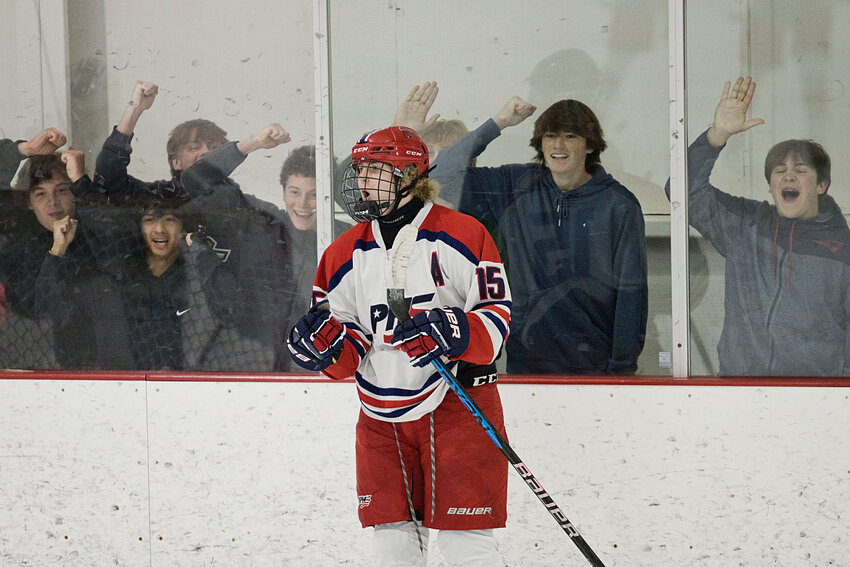 Portsmouth High fans celebrate along with Shane Temple after his second-period goal against South Kingstown at Portsmouth Abbey on Sunday. The Patriots prevailed, 5-1.