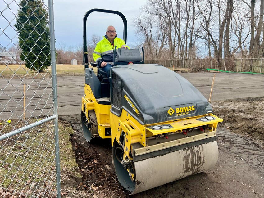 Paul Rodrigues, deputy director of the Department of Public Works, operates a roller last Friday at the Turnpike Avenue playground site. DPW dismantled the old playground, built in 1988, to make room for a new one being financed by the Four Hearts Foundation.