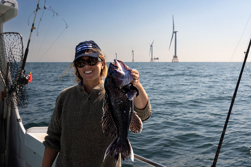 Claire Hodson with a healthy black sea bass caught on the charter fishing vessel Snappa. Both RI and MA will determine catch limits for black sea bass next month.
