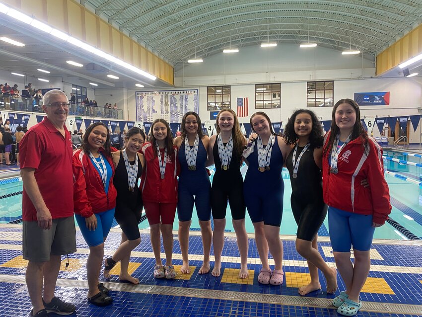 The athletes and coaches of the EPHS girls' squad after winning the 2024 Division IV Swimming Championship Meet Friday, Feb. 16, in Bristol