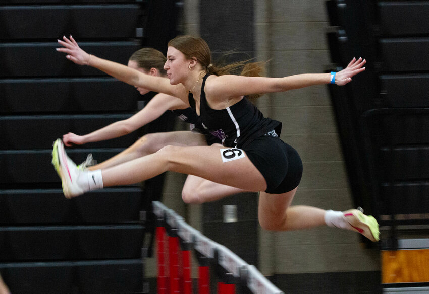 Lola Silva leaps over a hurdle during the 55-meter hurdles preliminary heat on Saturday.